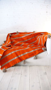 Orange  Pompom Blanket with gray stripes