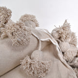 Khaki Moroccan Blanket with khaki pompoms