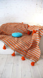 Gray Pompom Blanket with Orange stripes