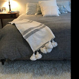 White Moroccan Blanket with gray stripes and White Pompoms