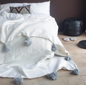 White Blanket with gray Pompom